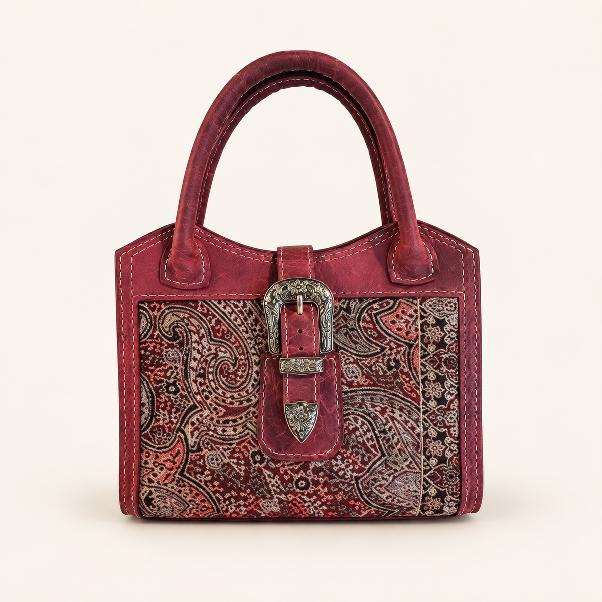 Embroidered Inlay Handbag on a warm ivory studio background