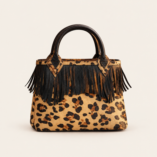 Western Fringe Handbag on a warm ivory studio background